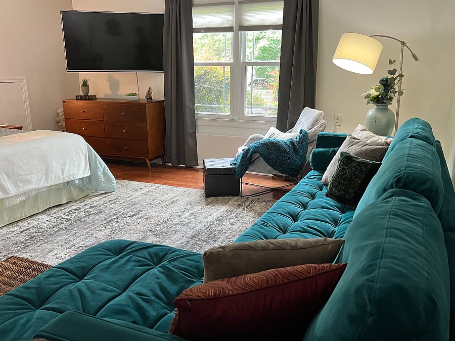 Warm, cozy space with a wall-mounted TV that can be turned to suit your viewing comfort.