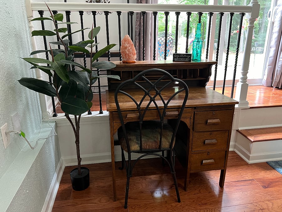 Look out into the backyard garden while working at this lovely antique desk.