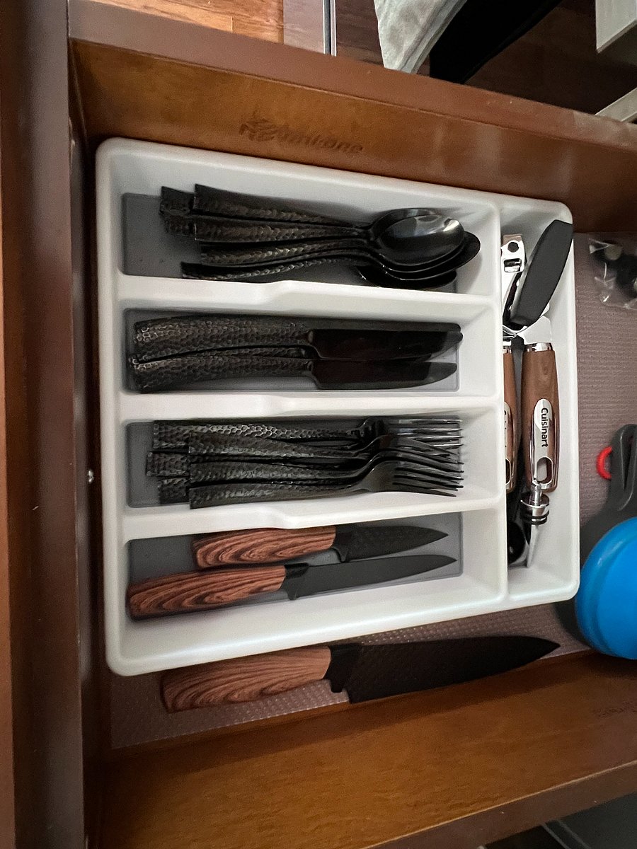 Lots of silverware and other useful kitchen items.