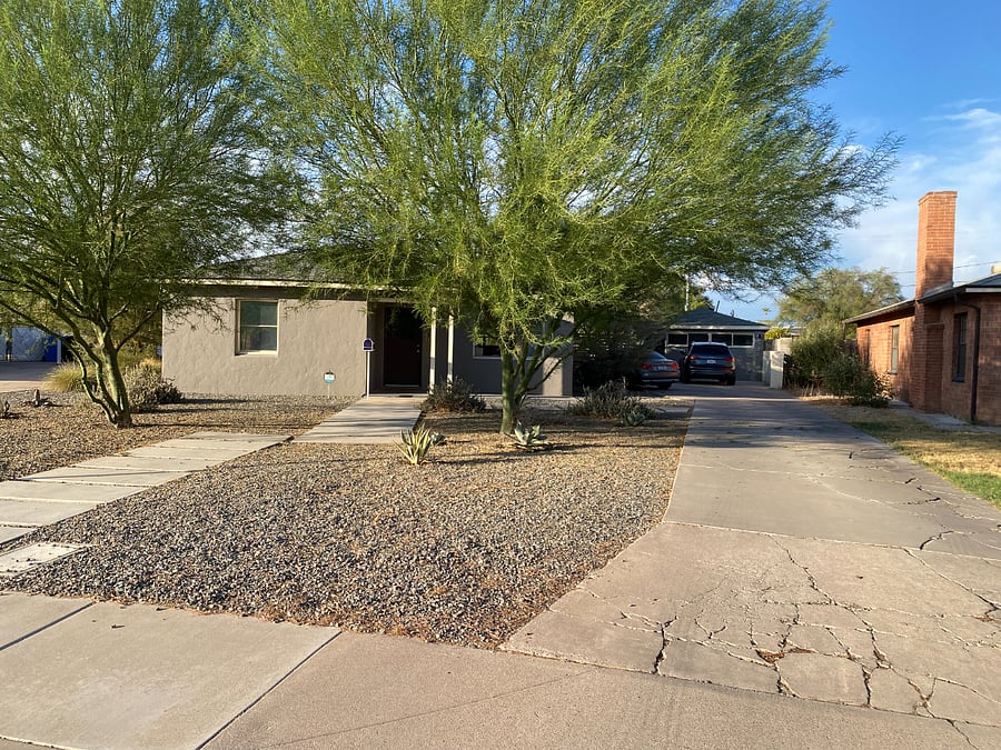 large yard and long shared private driveway in front of property for tenant and owner