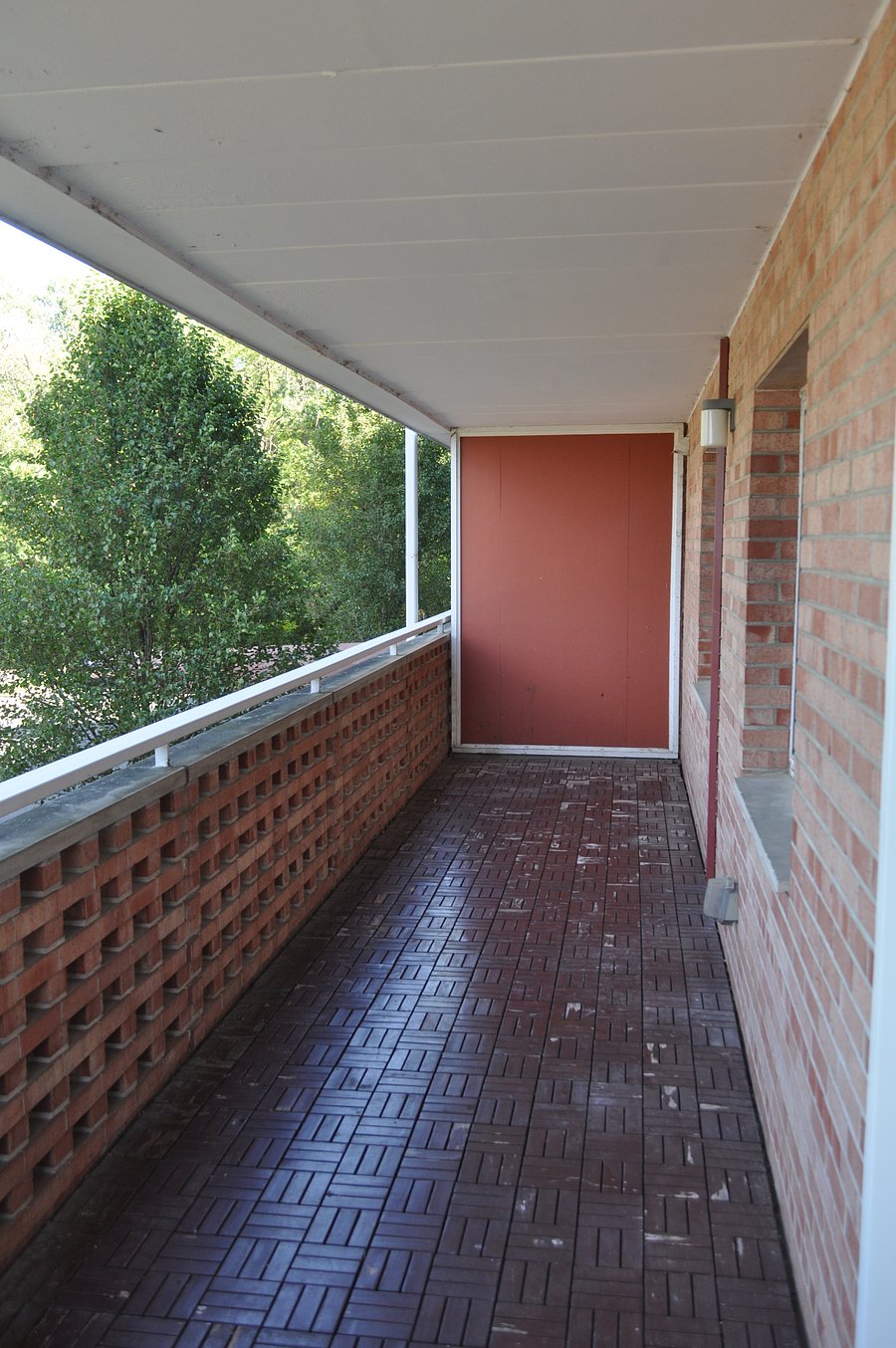 The porch is very long, massive really, and we now have chairs and a table for it despite them not being in this photo!  We will update that soon!