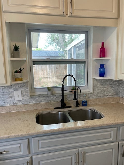 Modern faucet and plenty of storage.