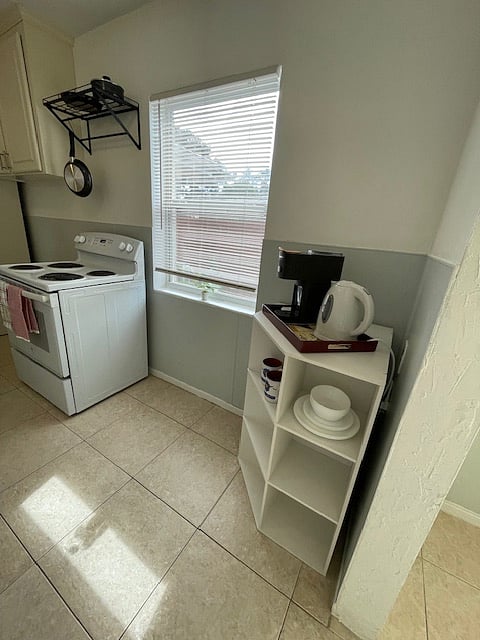 Coffee bar with hot water kettle and more storage.