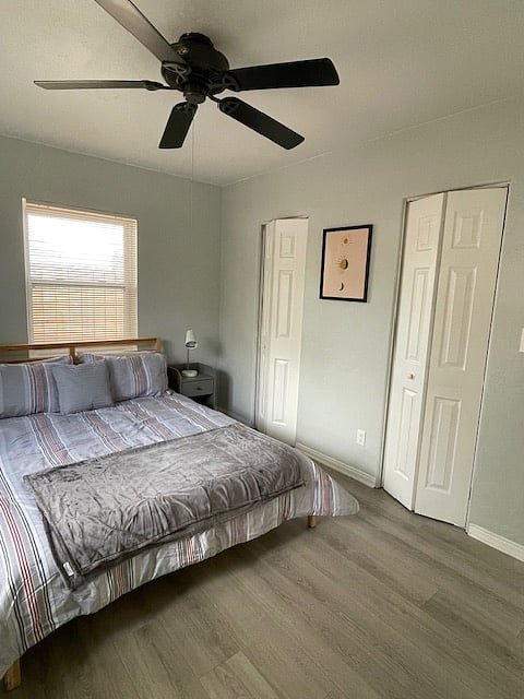Master bedroom with nightstands and reading lamps.