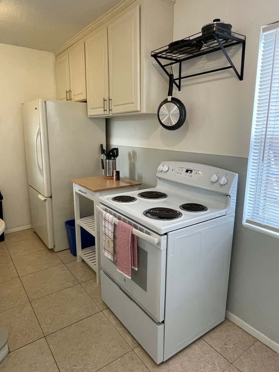Stove with storage cart for added prep space.