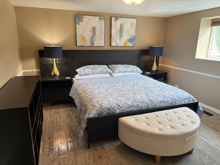 King bed. Cell phone charging plugs built into night stands.