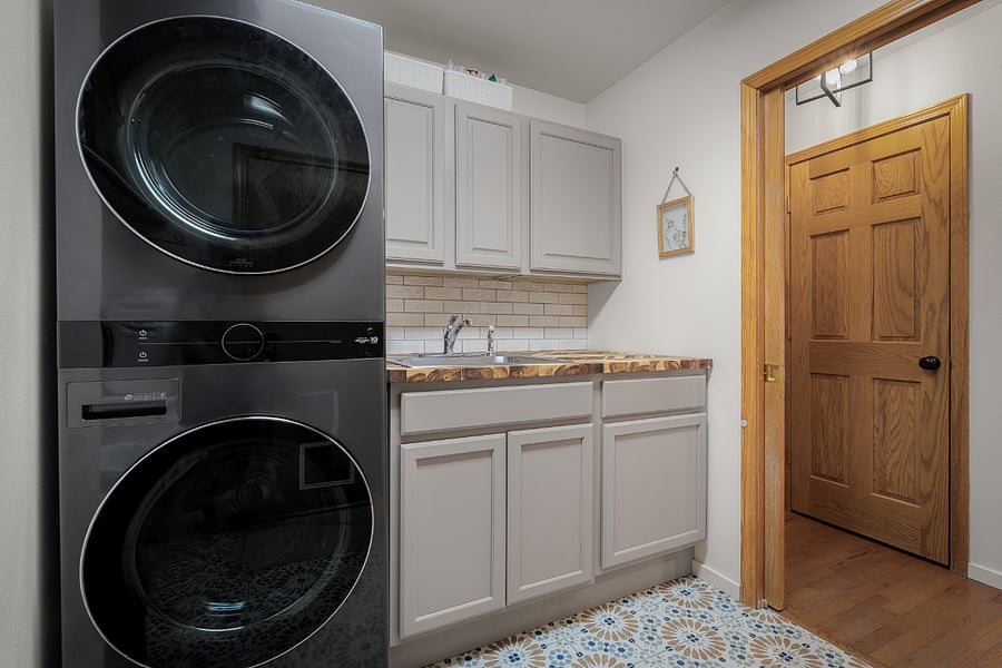Shared space - Laundry room with cabinet storage