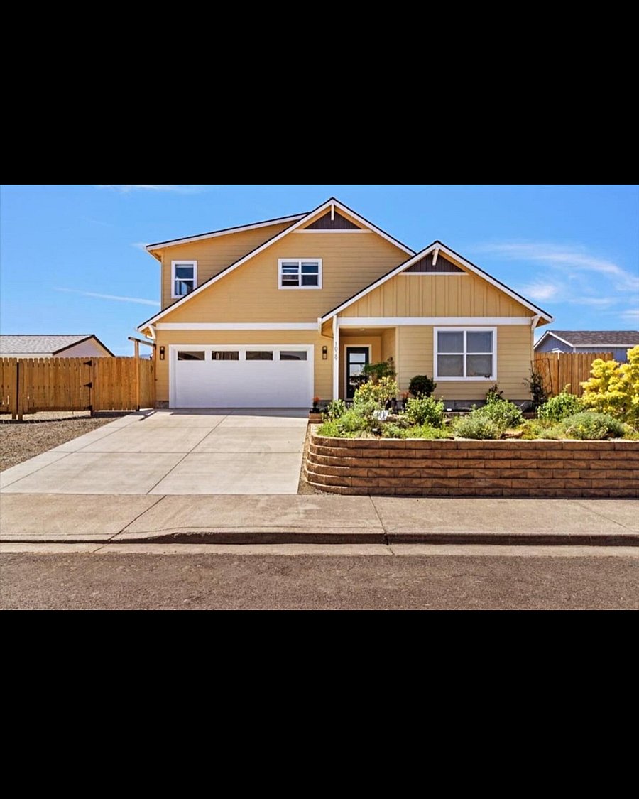 Main home, tenant parking is on the left in front of fence.