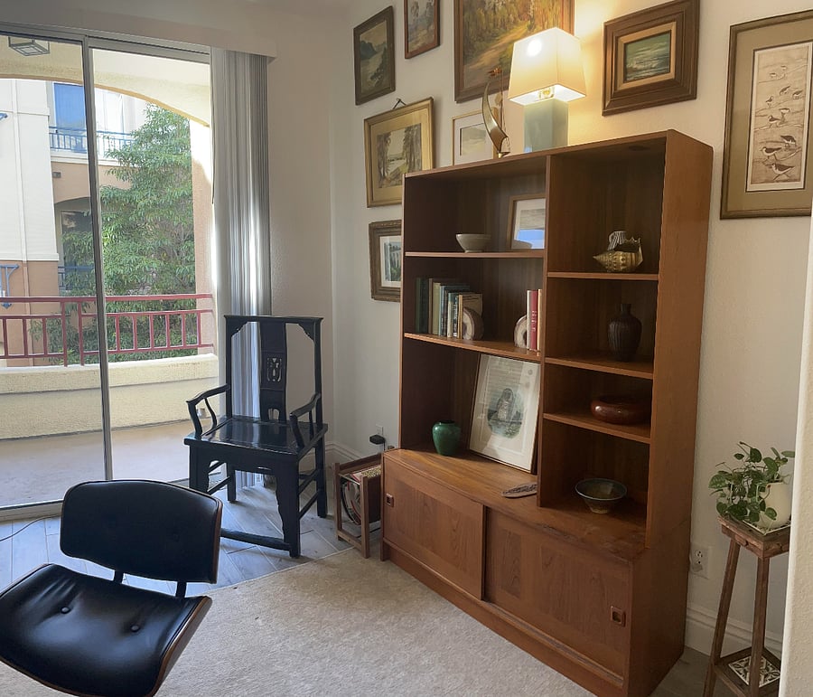 MCM wall unit provides more storage. We are happy to move this to another room if you prefer.