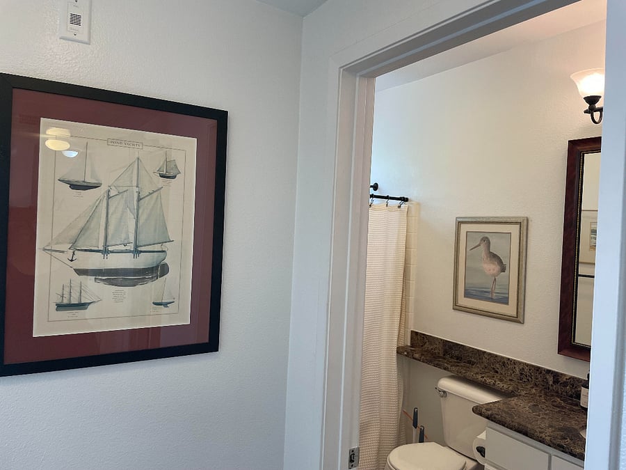 Full guest/second bathroom at the end of the hall just past the primary bedroom.