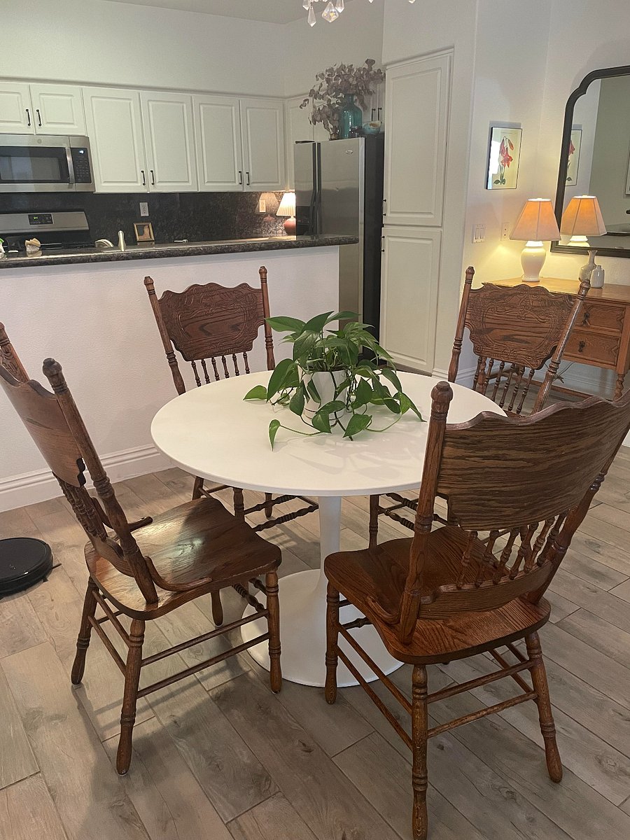 Two more of the same chairs are placed in other rooms.
