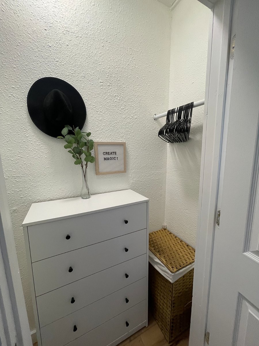 Closet with plenty of hanging and storage options. 