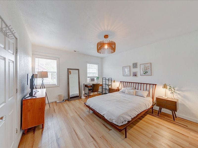 Master bedroom with queen bed. Ample closet space. Desk. 6-drawer dresser. Smart TV. 