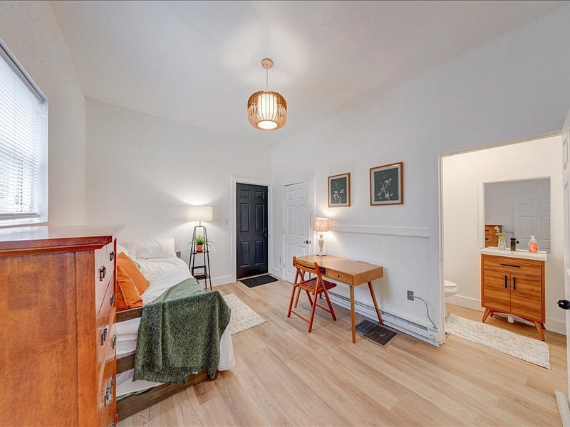 Third Bedroom - Conveniently located on the first floor, this room includes a twin bed and an attached half bath.