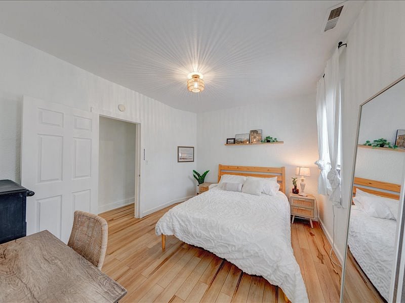 Second Bedroom. Situated on the second floor, this room offers a queen bed, six-drawer dresser, spacious closet, and a desk.