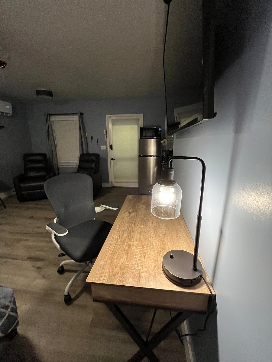A work desk large enough for a double monitor setup; complemented by a very comfortable and space-saving office chair.