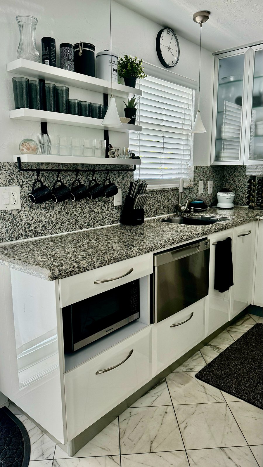 Granite slab countertops and backsplash.