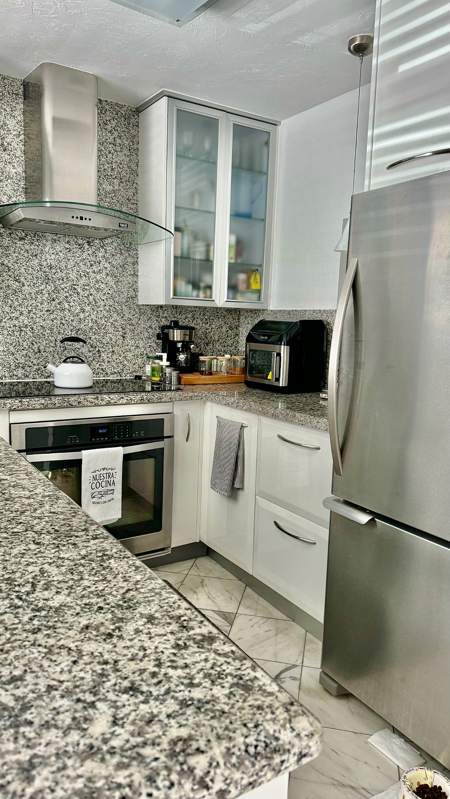 Top level SS appliances inc. drawer dishwasher and double sink with disposal, etc.
