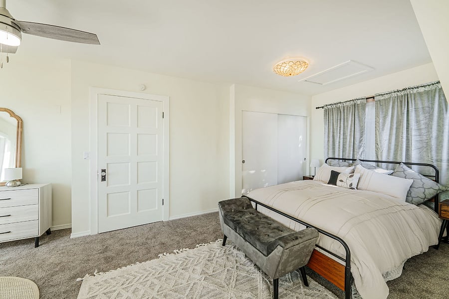 Master bedroom with a closet and dresser