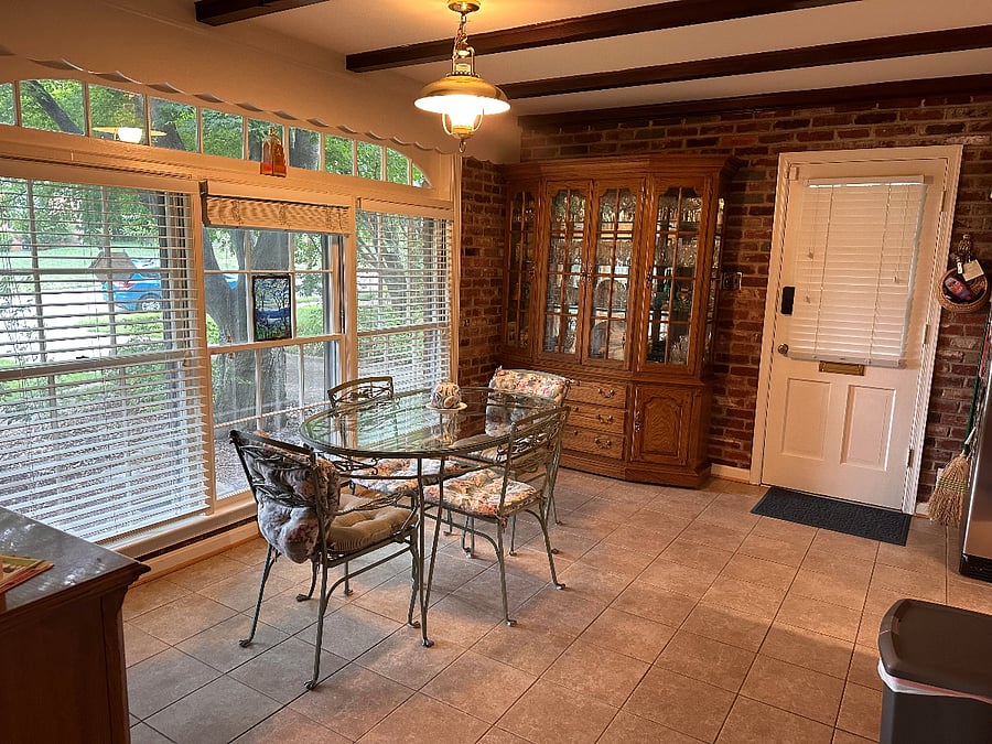 Kitchen table area with view of front yard..