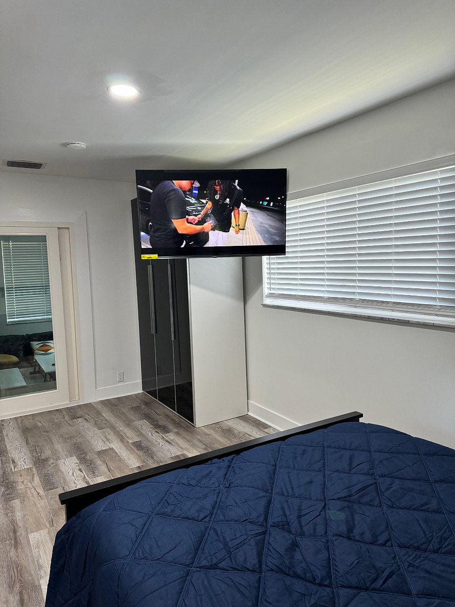 bedroom with 55 inch TV