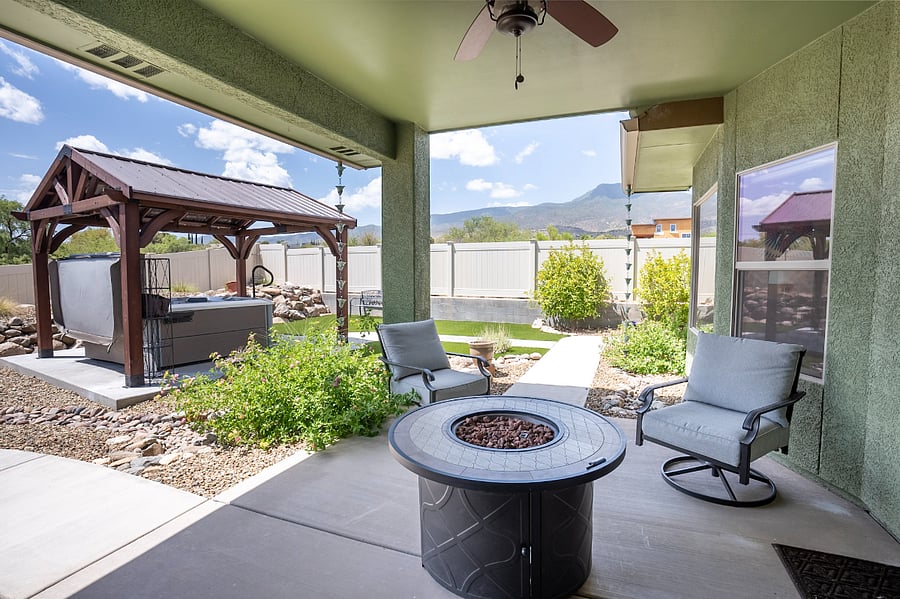 West side fire table and jacuzzi with gazebo.  Fire table with seating for four.