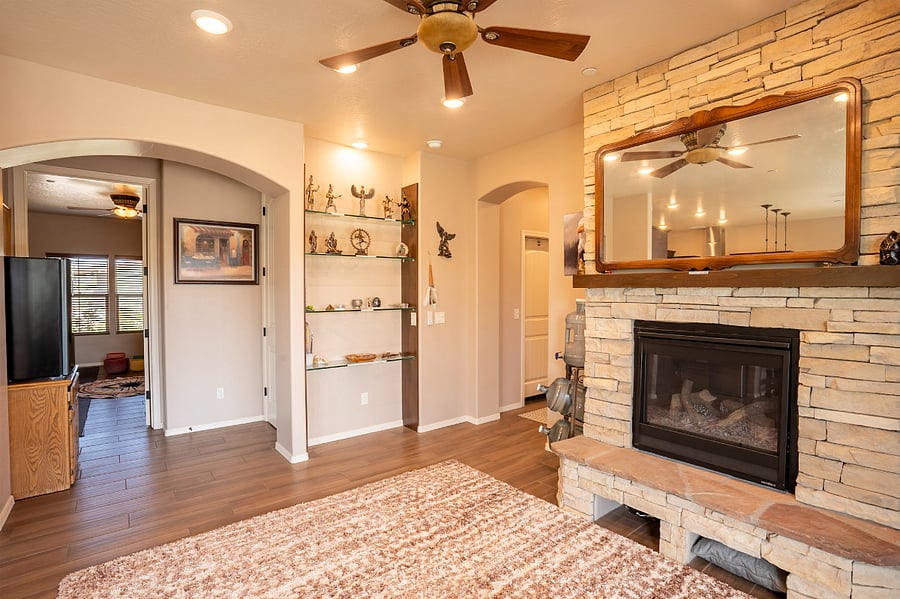 West side living room with full fire place. 