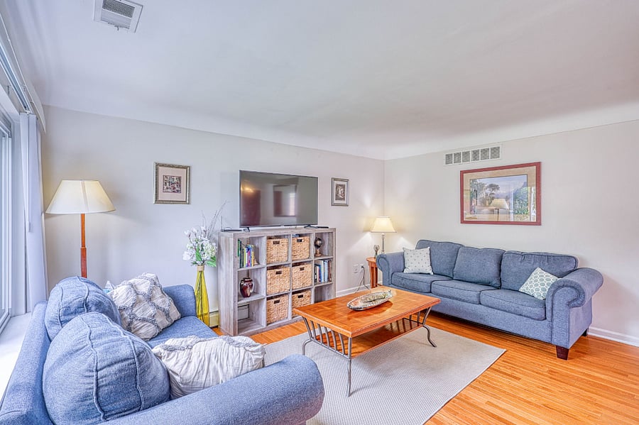 Nice-size living room with TV, books & games