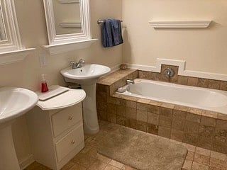Master bathroom adjoins MBR, w/ separate shower, tub, linen closet & double vanity.
