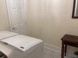Laundry room off kitchen with washer/dryer & closet.