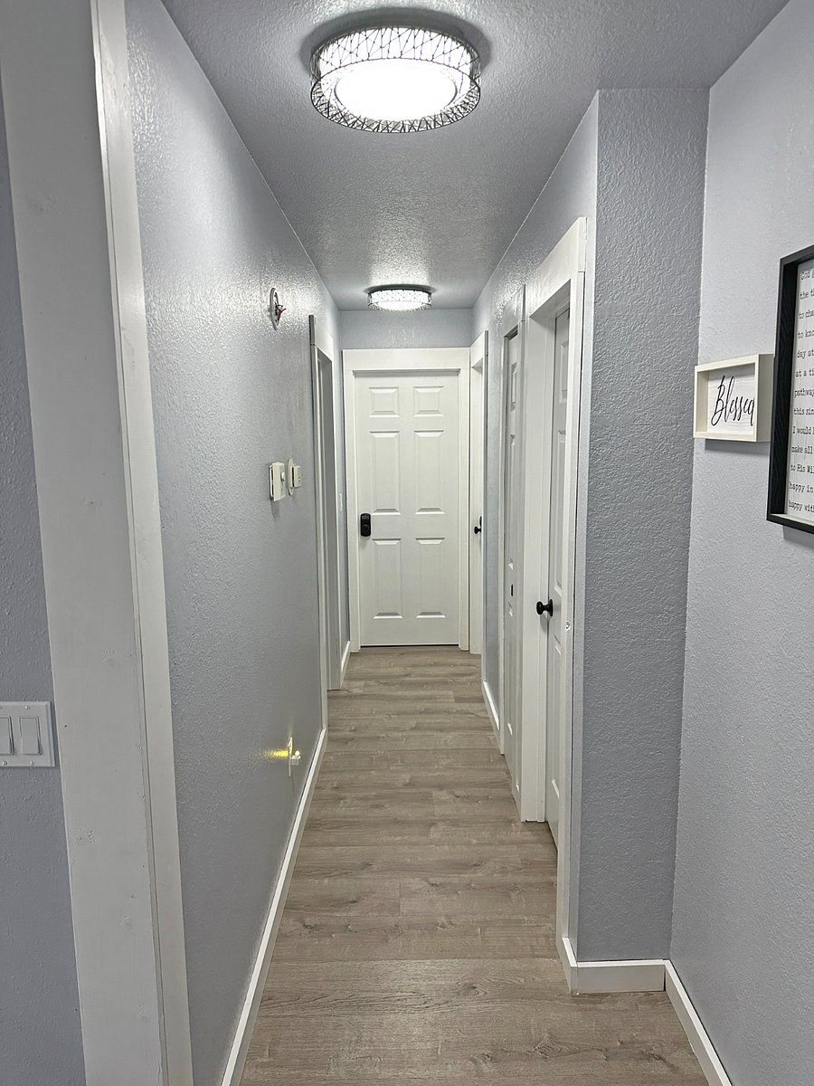 Hallway leading to private bathroom (first right) and rented room (end)