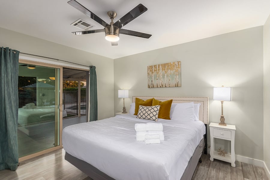 [Bedroom #3] King bed & sliding doors to backyard
