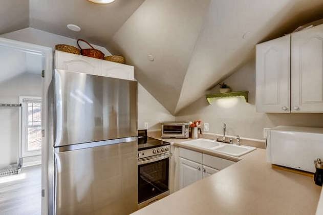 Complete kitchen with apartment-size glass-top stove, full-size refrigerator, microwave, all utensils, pots, pans, blender, coffee pot, Keurig, hot water kettle, along with starter cleaning supplies.