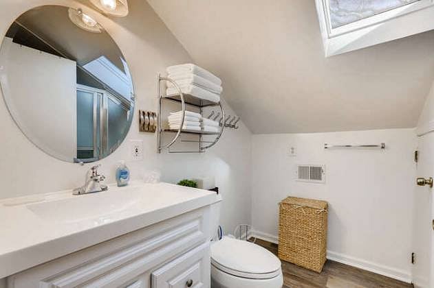The full bathroom with starter supplies, and linens.