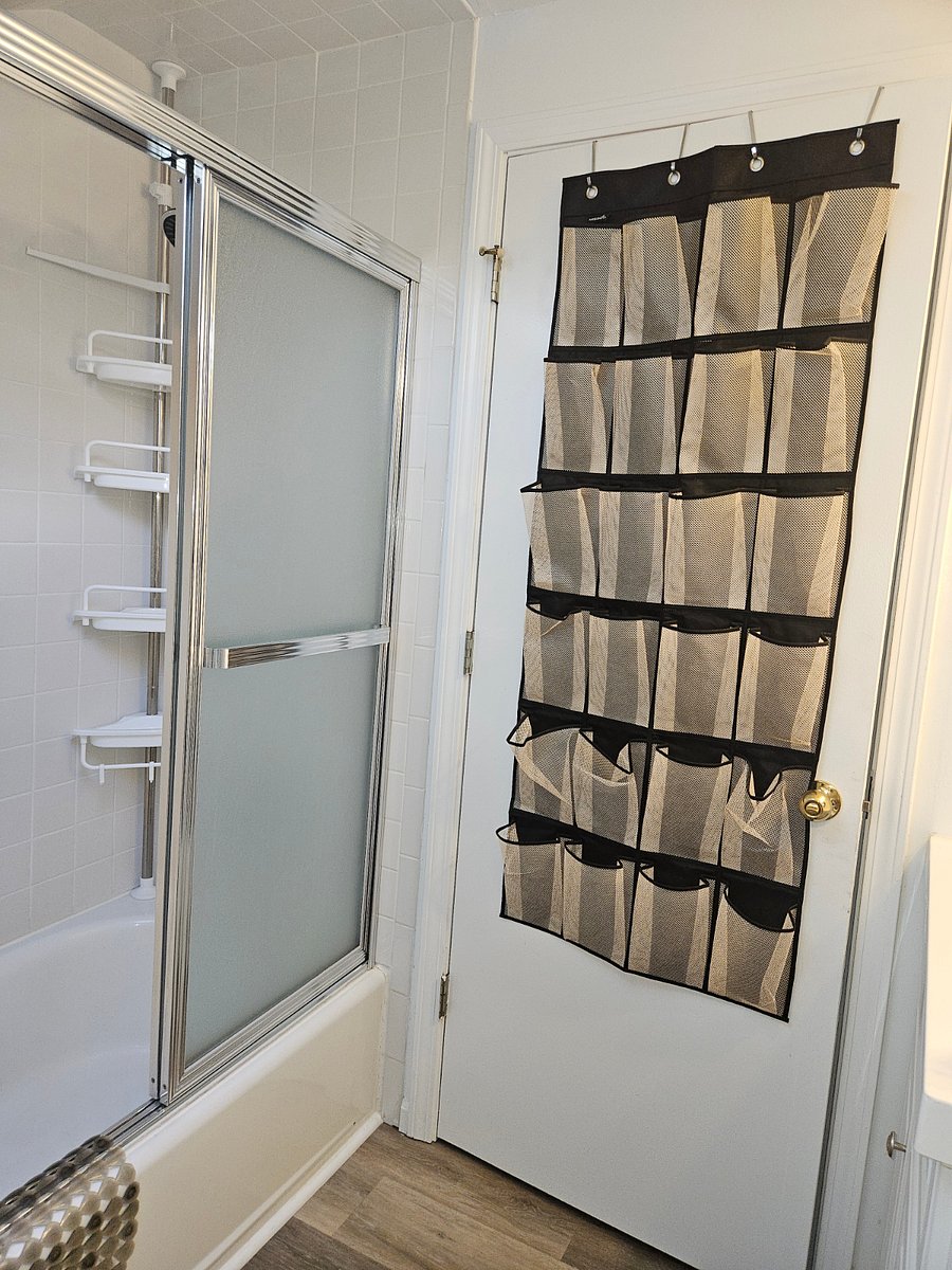 Convenient usable storage on the back of the bathroom door.