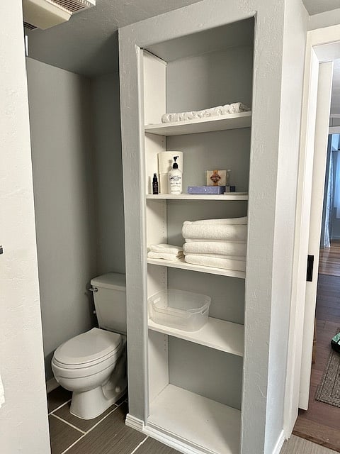 Additional storage closet in bathroom