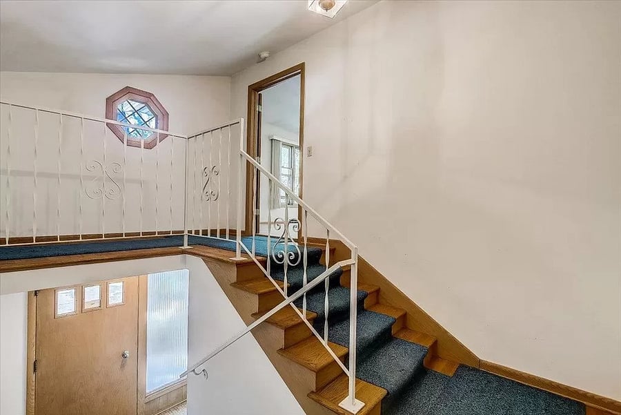 Private entrance via entry hallway, shared with 1 other tenant, from the duplex front entryway. 1 flight of stairs is required to enter the unit. There is no other ground level entrance, as unit is above garages.