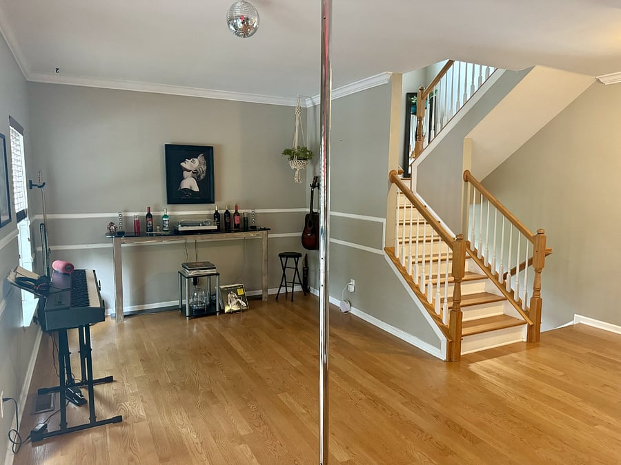 2nd level common area w studio mirrors and dancing pole-lots of options for fitness, fun, dance, or yoga! 
