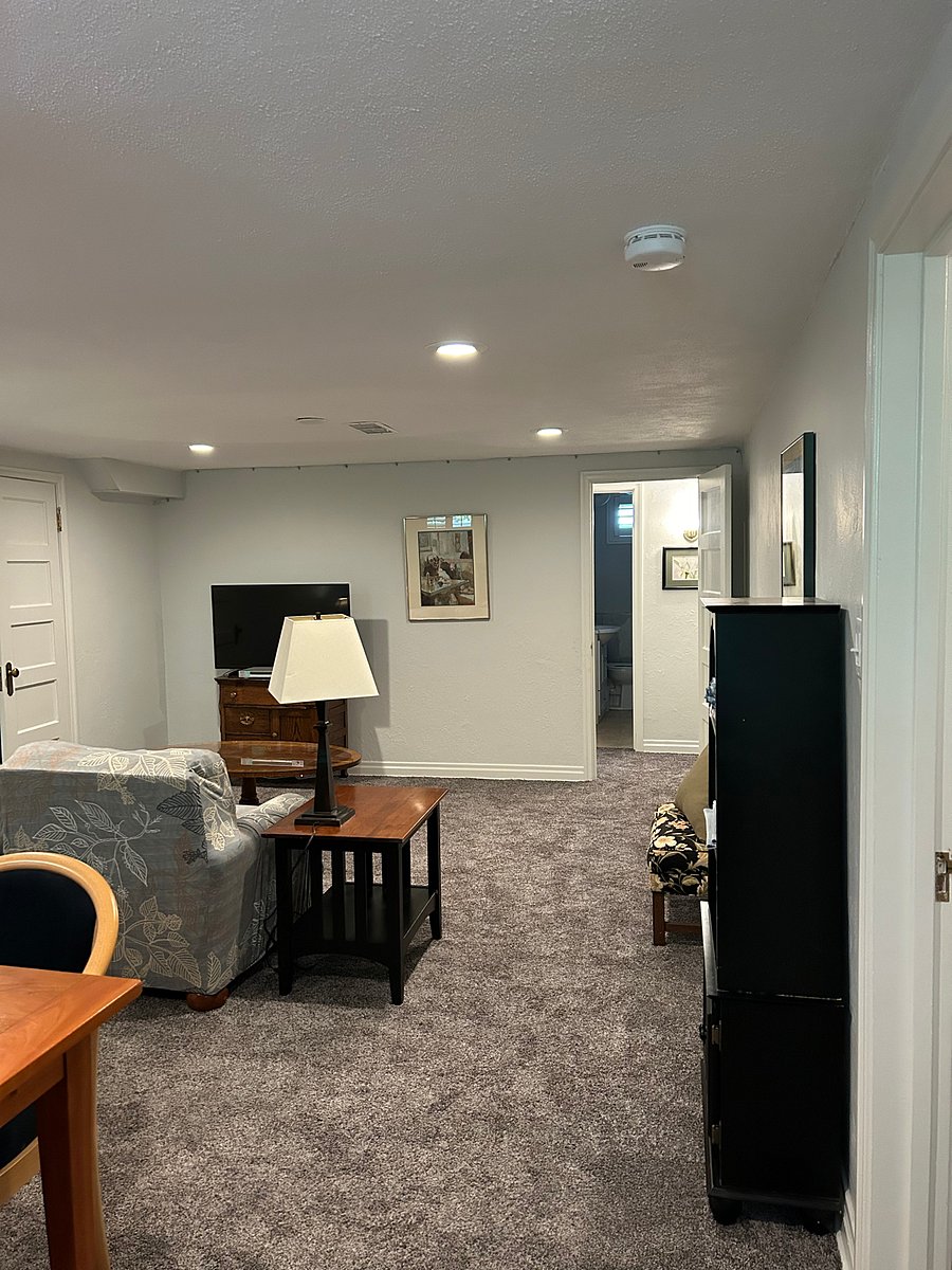 Central living area (storage closet on left) looking at back hallway, bath