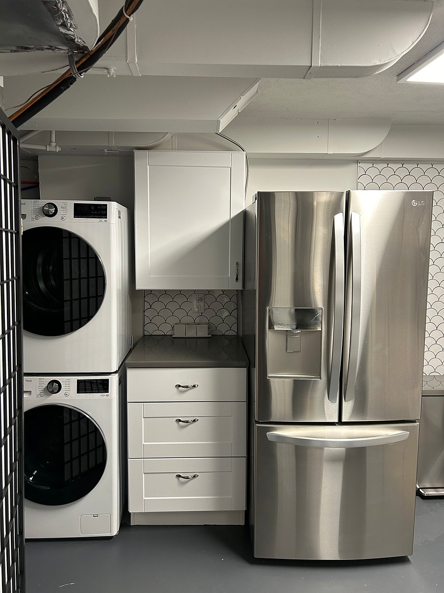 Frig, Washer and Dryer in kitchen