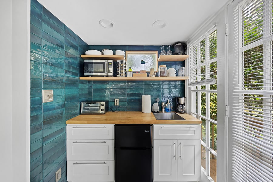 Kitchenette with microwave, toaster oven, kettle, mobile stovetop, pots & pans, and coffee!