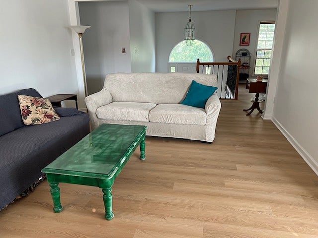 Living room with washable furniture covers to ensure complete sanitation between guests. Sanitizeable LVP throughout.