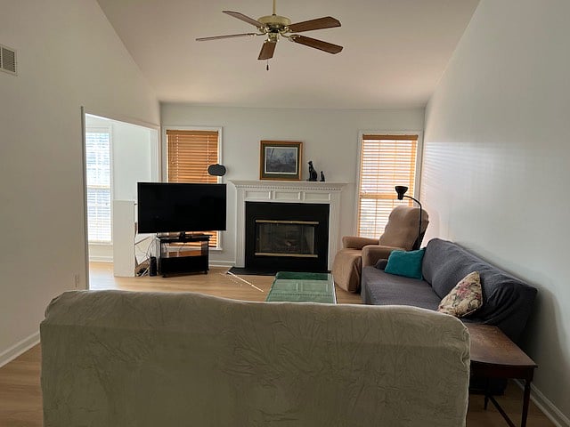 Living room with washable furniture covers to ensure complete sanitation between guests. Sanitizeable LVP throughout.