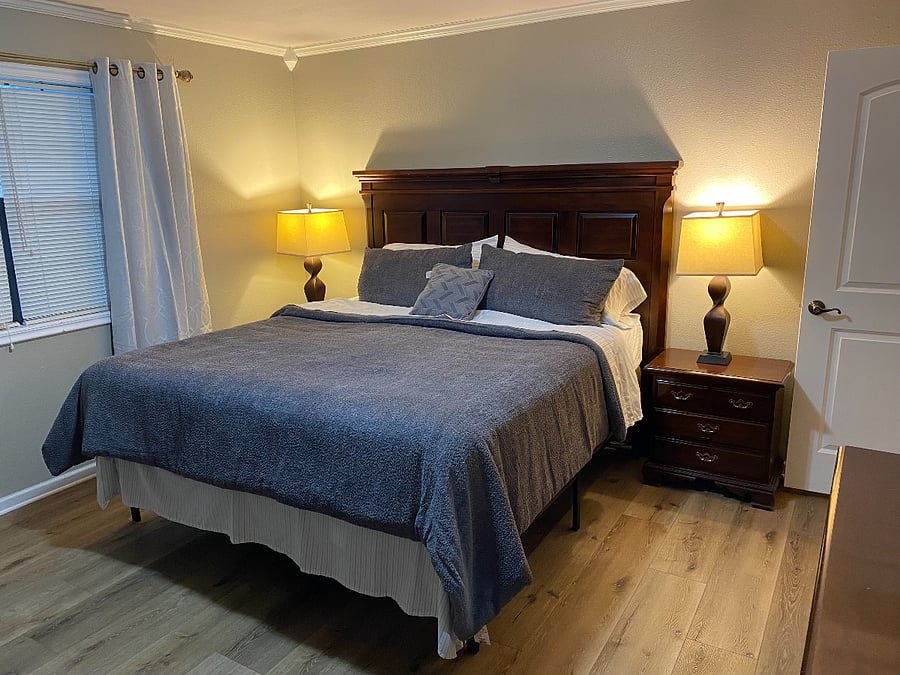 Primary bedroom with king size bed. 