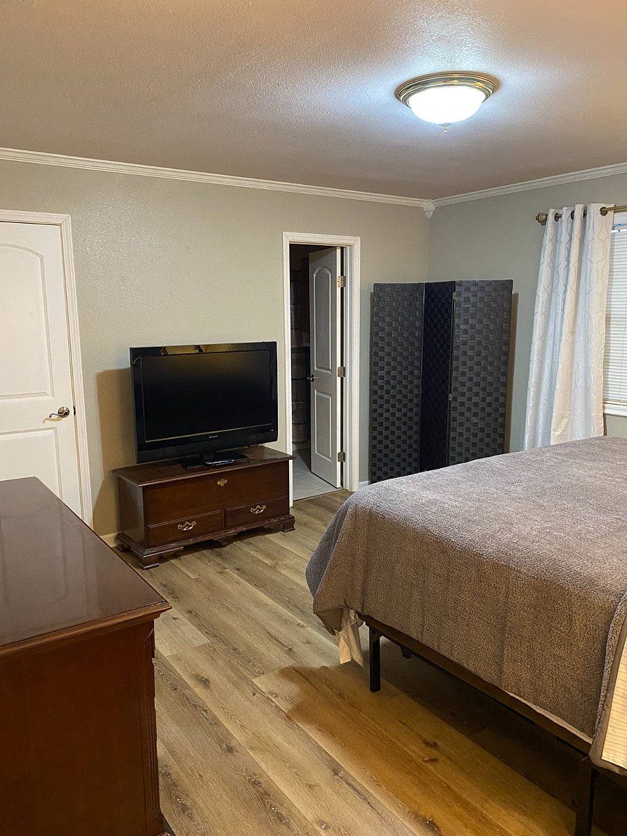 Primary bedroom with king size bed. 