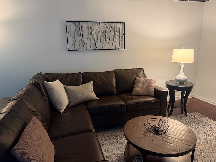 Beautiful living room with pottery barn leather sofa. Large screen. Smart tv. WiFi