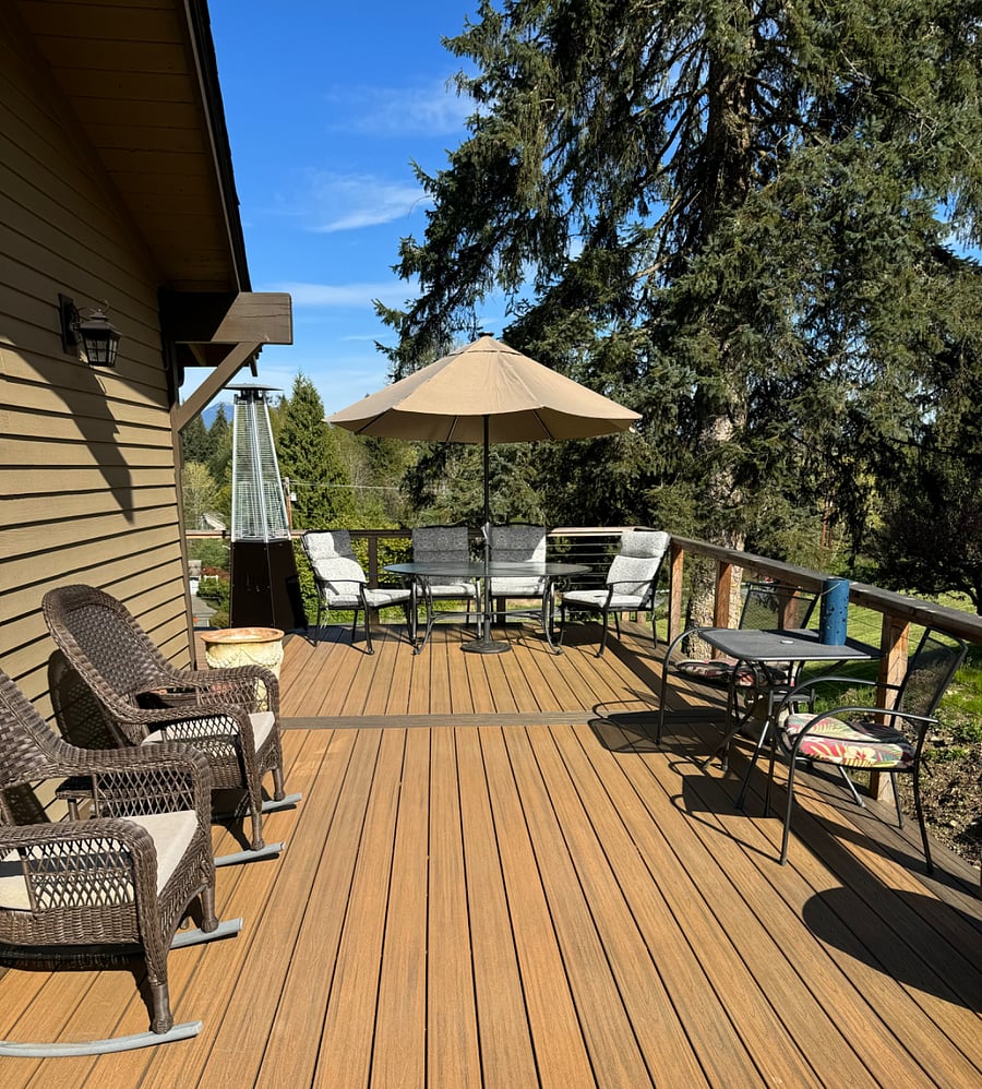 More deck space, 2 rocking chairs, umbrella has evening lights, small table for extra seating, shade table & seating for 2 on East side of deck