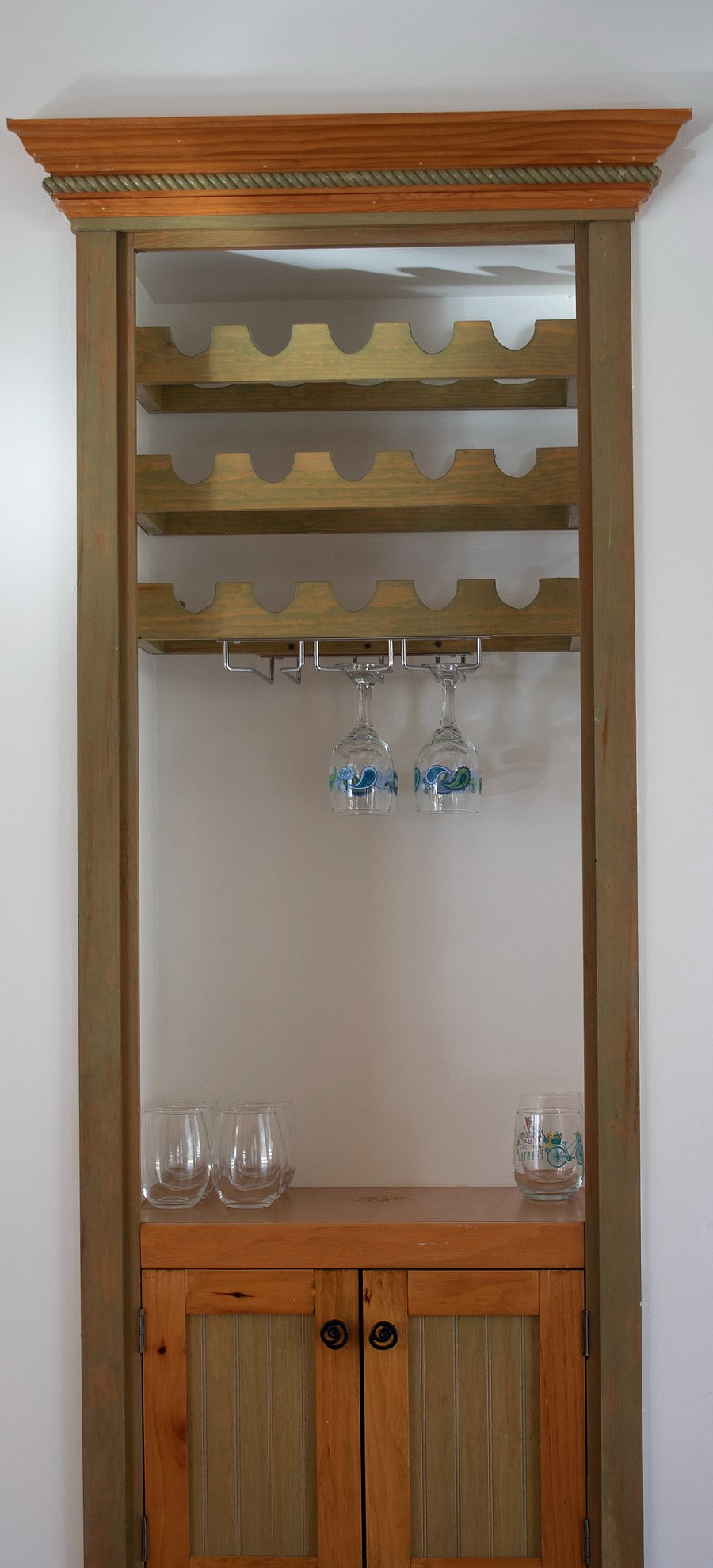 Wine cabinet with glasses.