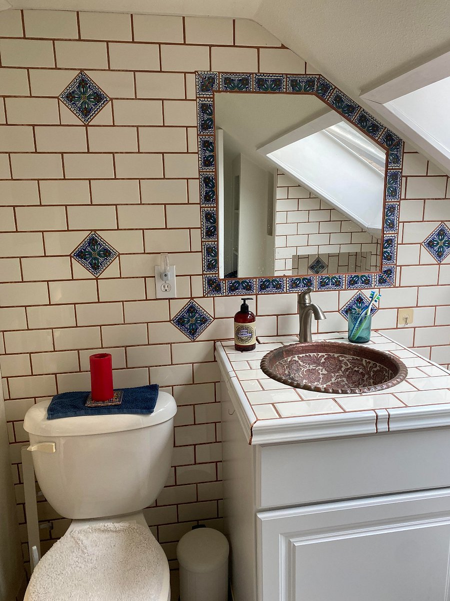 Upstairs bathroom has a Latin tile vibe to it.