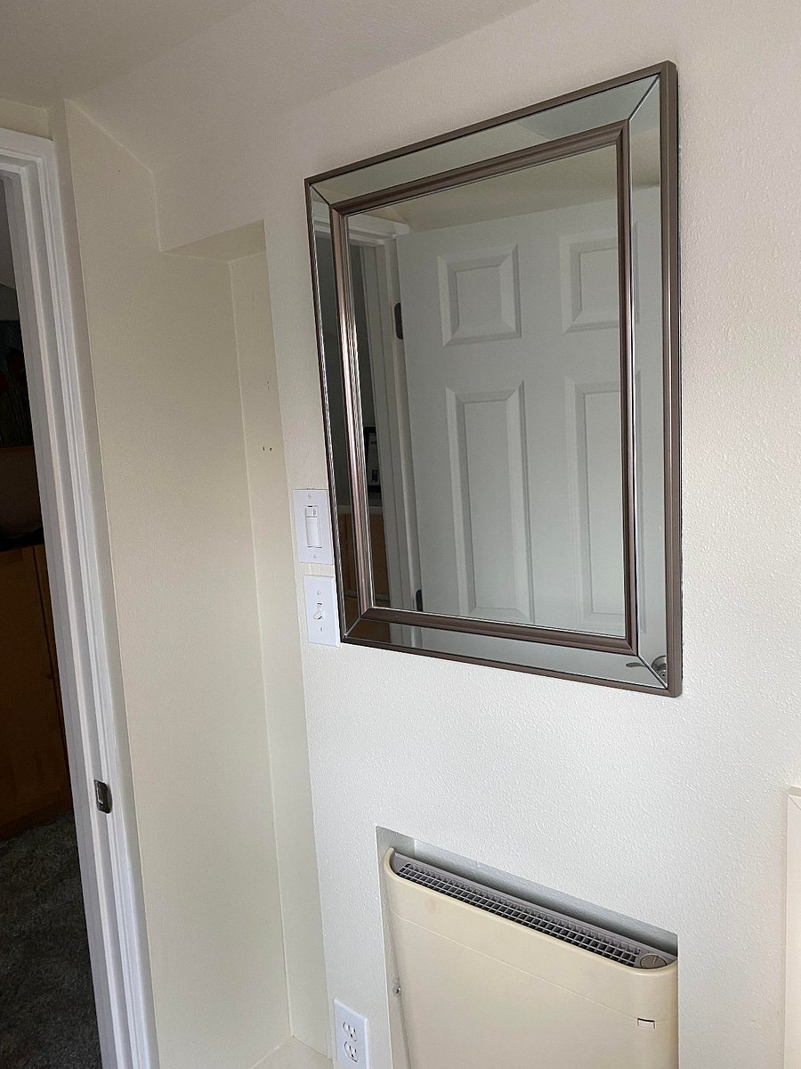 Mirrors and bathroom cabinets provide plenty of space.